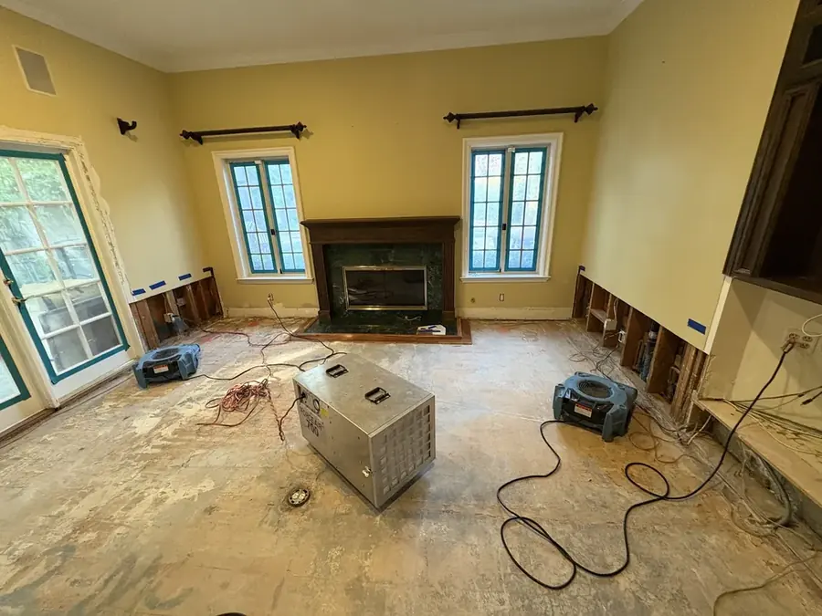 A dehumidifier drying a flood-cut room in a San Gabriel Valley home
