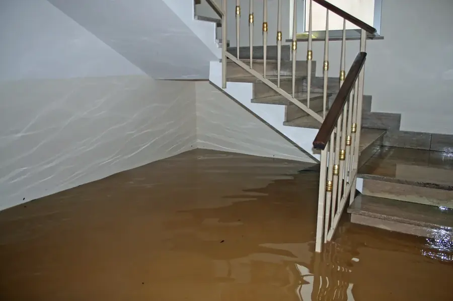 Water spreading across the floor of a San Marino, CA home after a leak