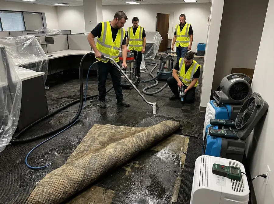 Crew extracting water from the carpet of a flooded San Gabriel Valley office